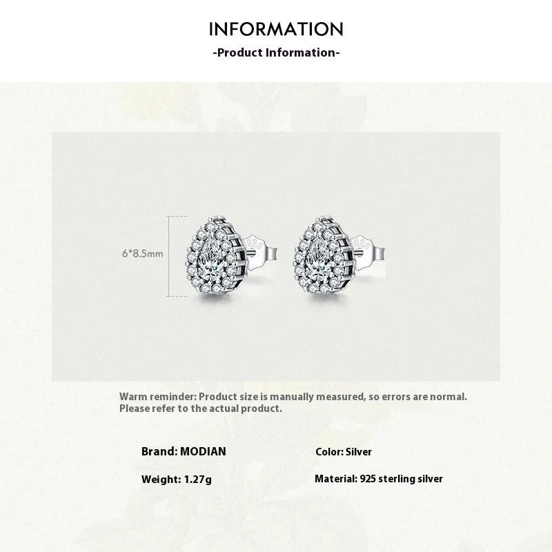 Women's drop-shaped silver ear studs in 925 sterling silver with diamond treatment