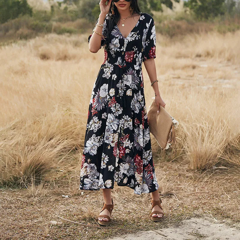 Yellow floral summer dress with V neck and elastic waist on mannequin