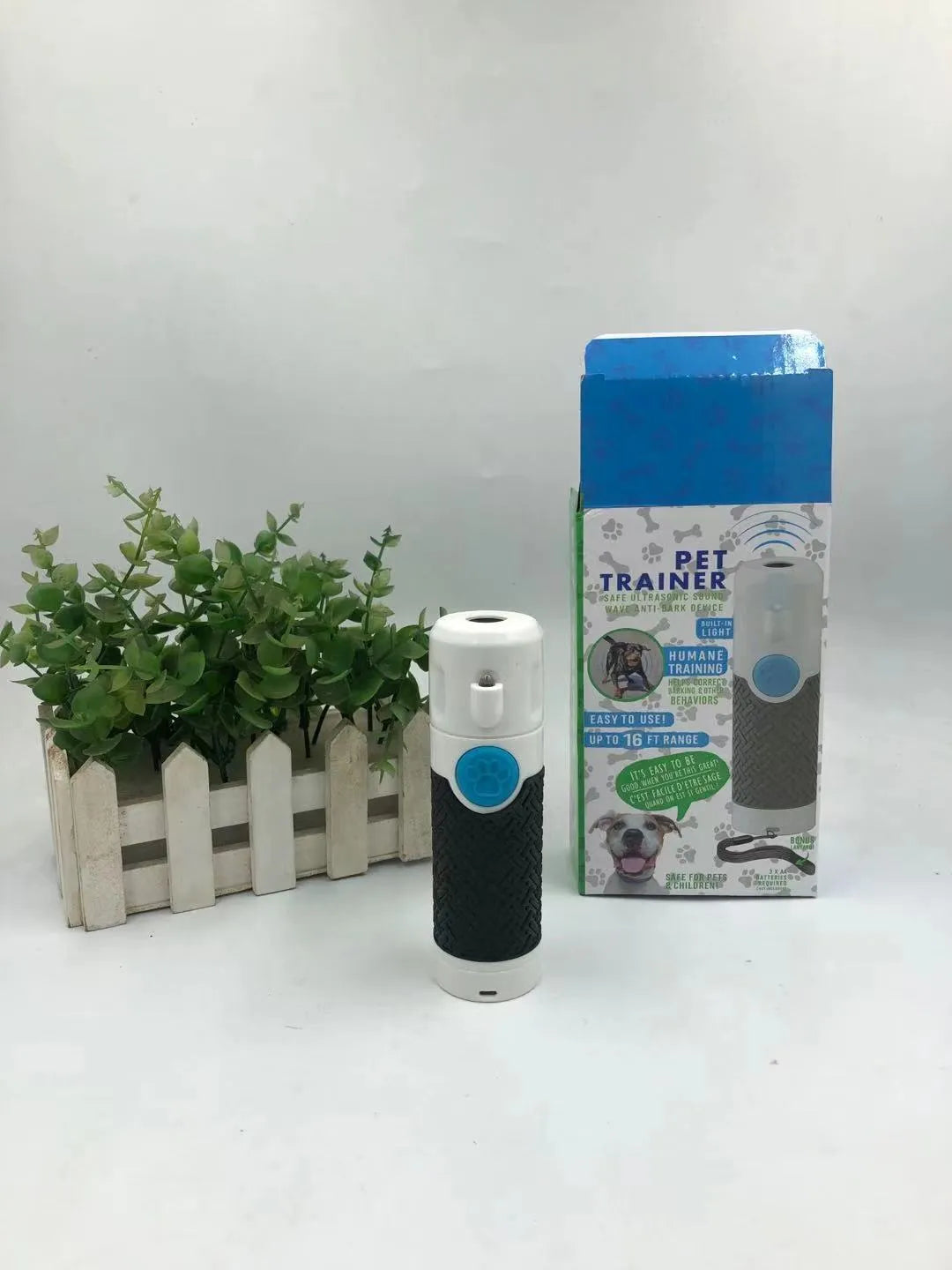 White handheld ultrasonic dog bark control trainer device with compact design