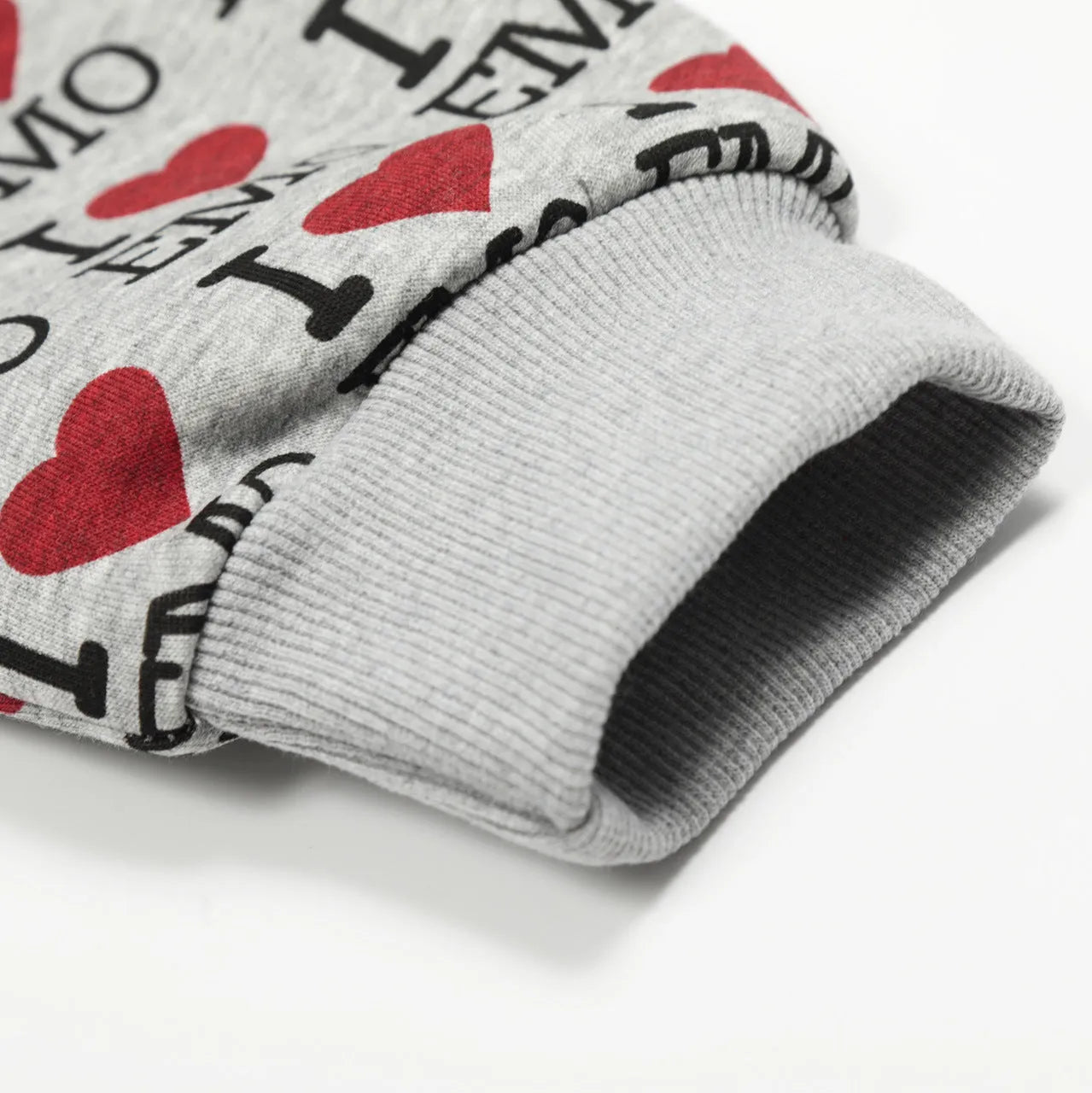 Women's melange grey hooded cardigan with a retro pattern, shown on a hanger.