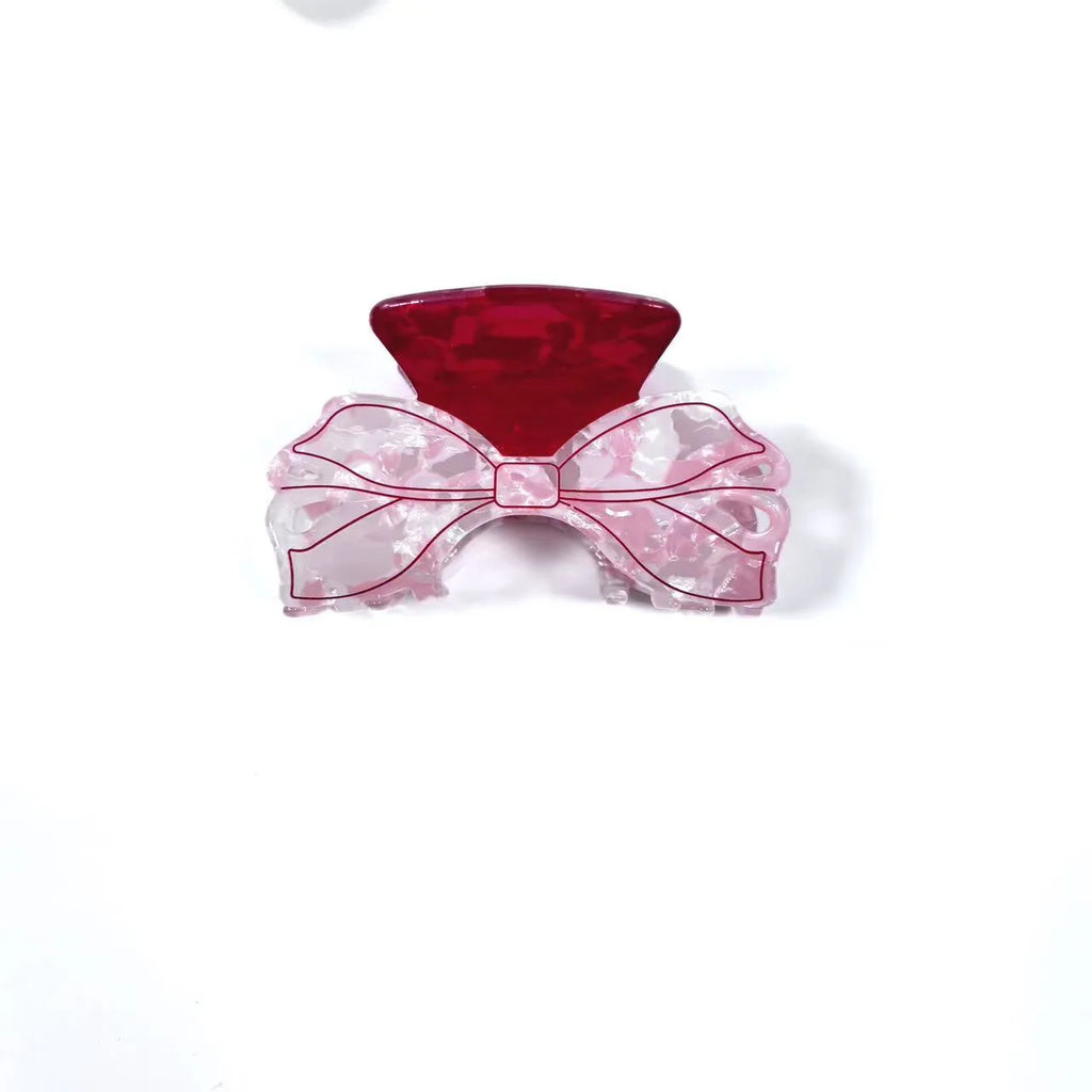 Acrylic bow tie hair grip in cream with glitter oil injection finish, 8cm long, for women
