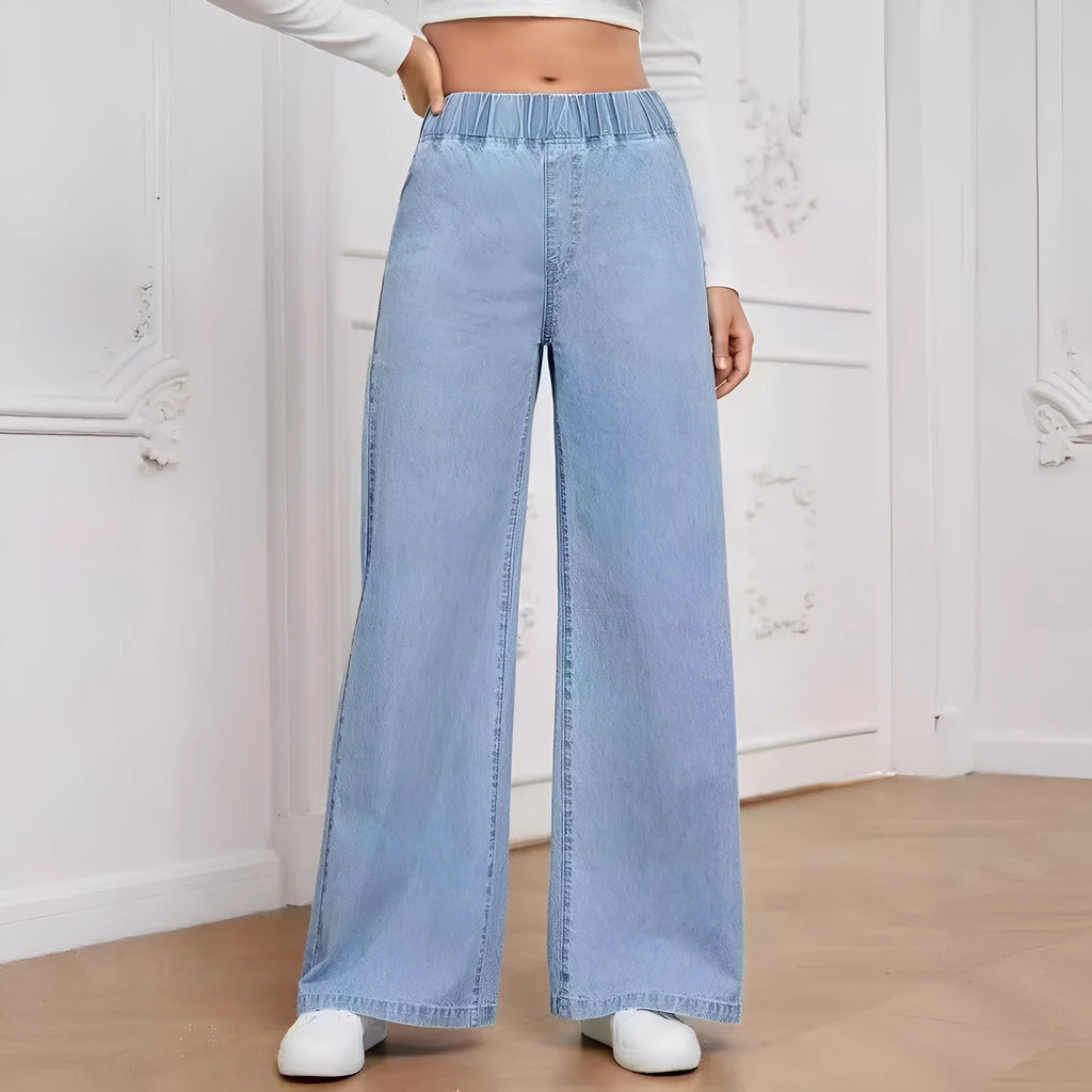 Light blue washed wide-leg denim jeans with straight cut and mid-rise waist on hanger