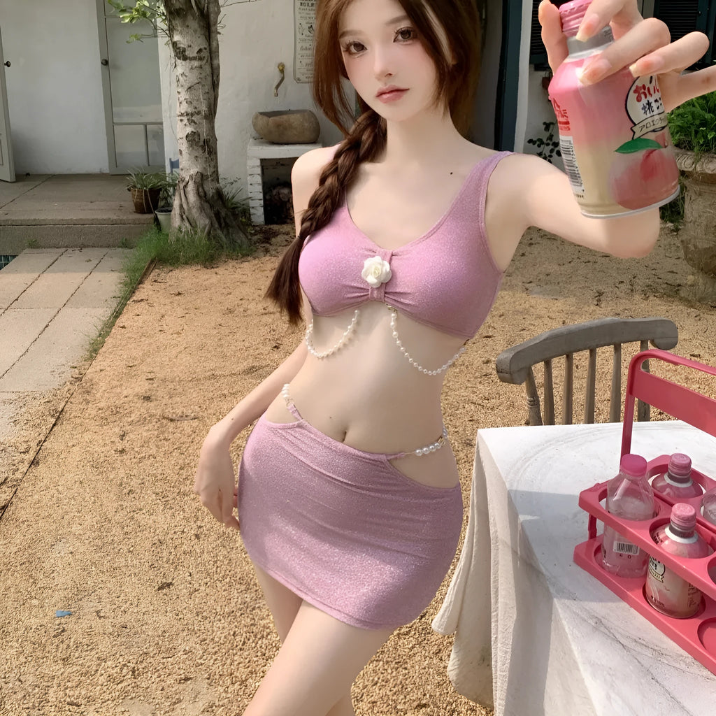 Women's pink and black three-piece polyester bikini swimsuit for swimming.