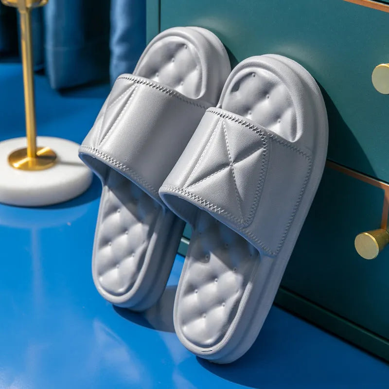 Soft EVA bath slippers in multiple colours showing thick non-slip sole.