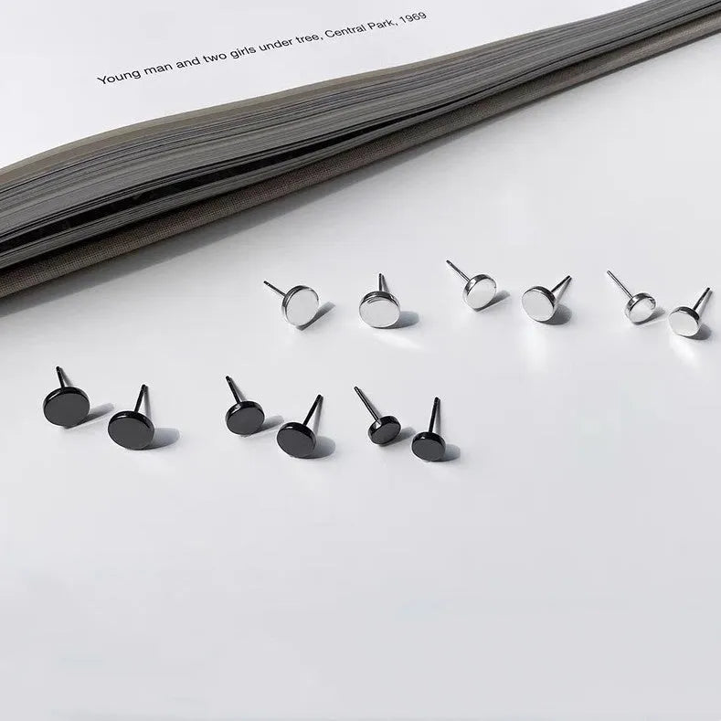 A pair of simple round flat S999 Sterling Silver ear bone studs for cartilage piercing.