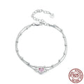Sweet girlish heart-shaped sterling silver bracelet with adjustable chain on a white background.