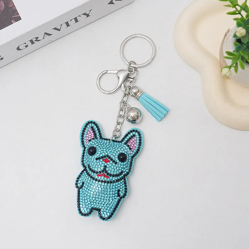 Cartoon French dog rhinestone keychain in alloy with electroplated finish.