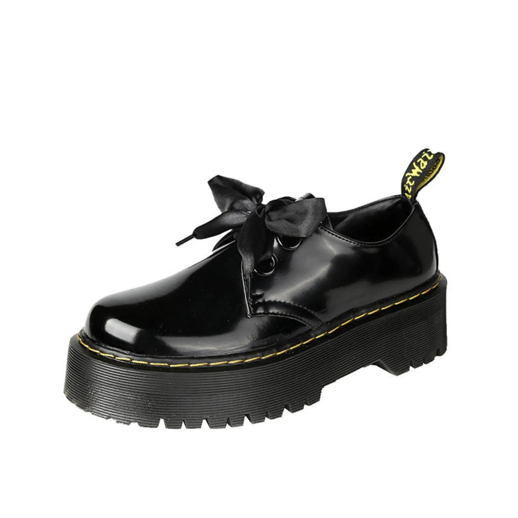 Women's black leather shoes with thick sole and cross-strap design