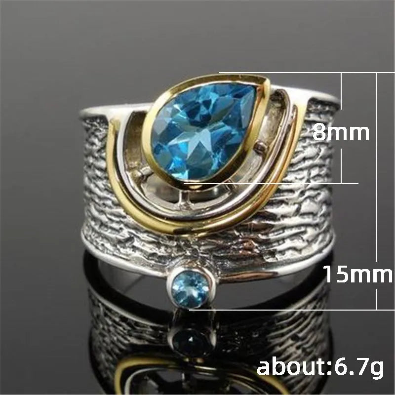 Close-up of a blue drop-shaped zircon rhinestone set in a creative Chinese style alloy women's ring.