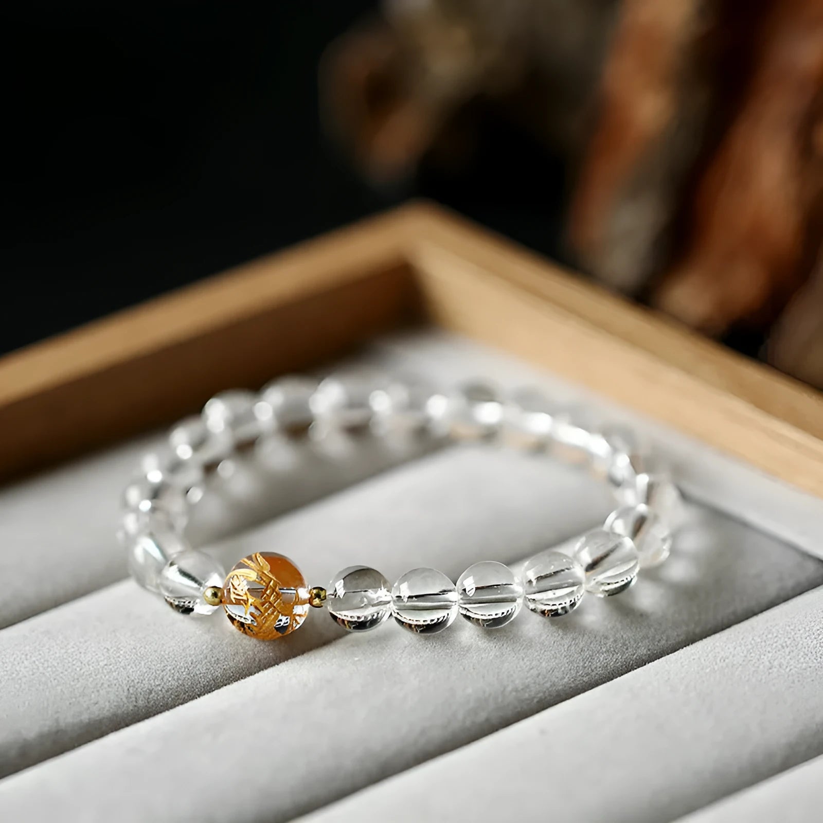 Unisex obsidian black agate and white crystal beaded bracelet on a neutral background, 10mm and 8mm beads