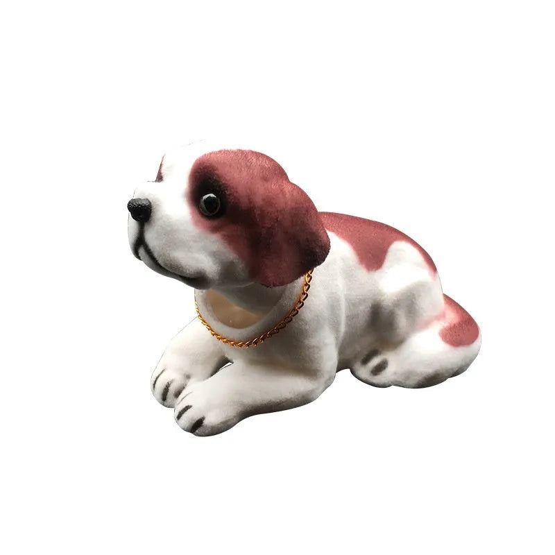 Resin head-shaking dog car decoration in multiple breed colour options on a car dashboard