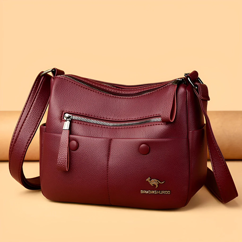 Soft PU leather crossbody bag in horizontal square shape with stitching detail, showing multiple colour options black dark blue wine red yellow.
