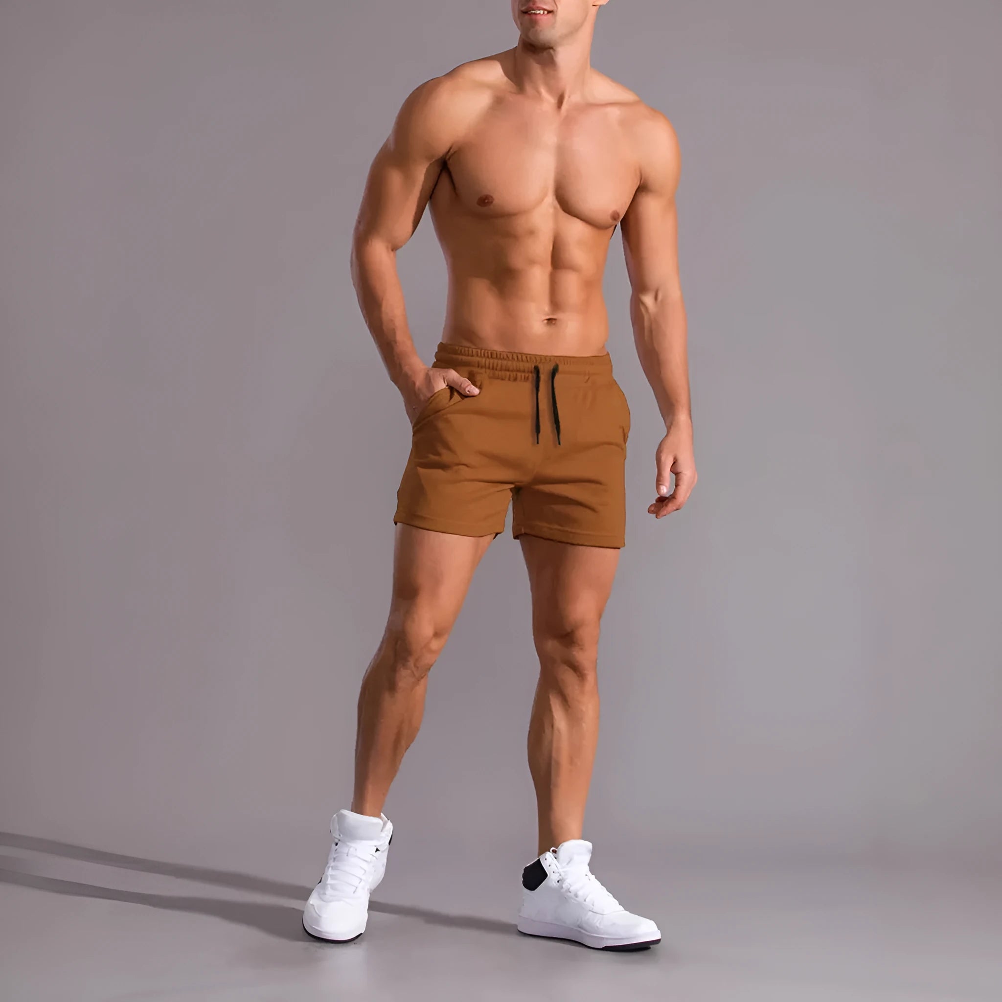 Pack of three men's casual drawstring shorts in black, khaki, and light brown colours laid flat.