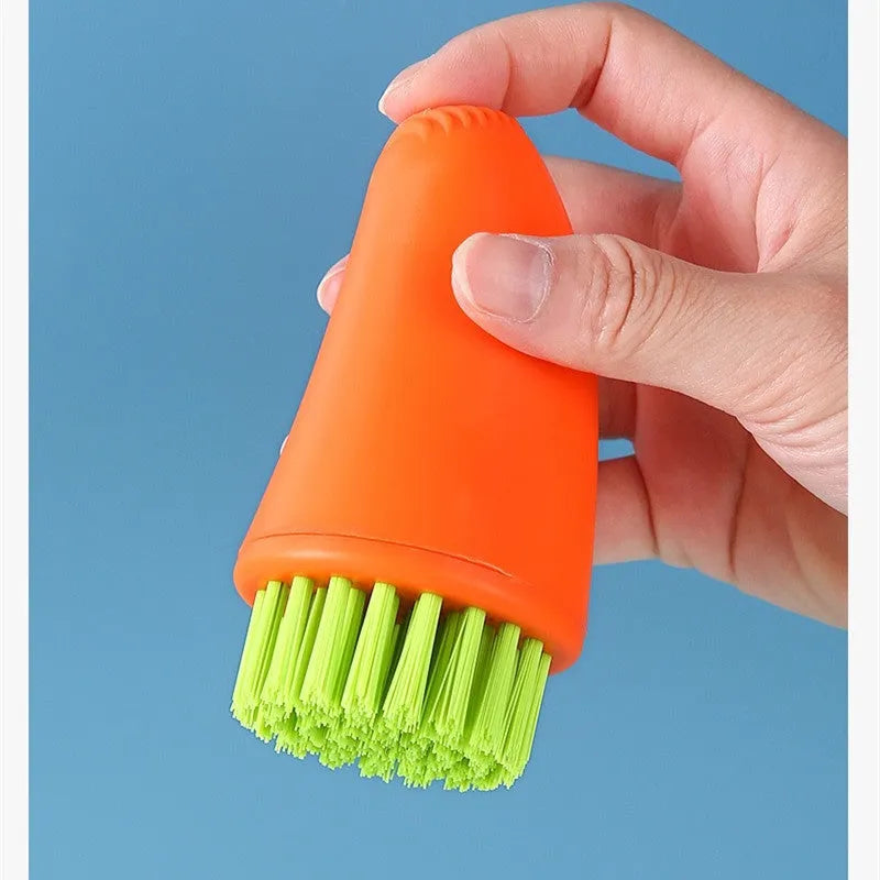 Multifunctional carrot brush with nylon bristles in white and orange for kitchen cleaning