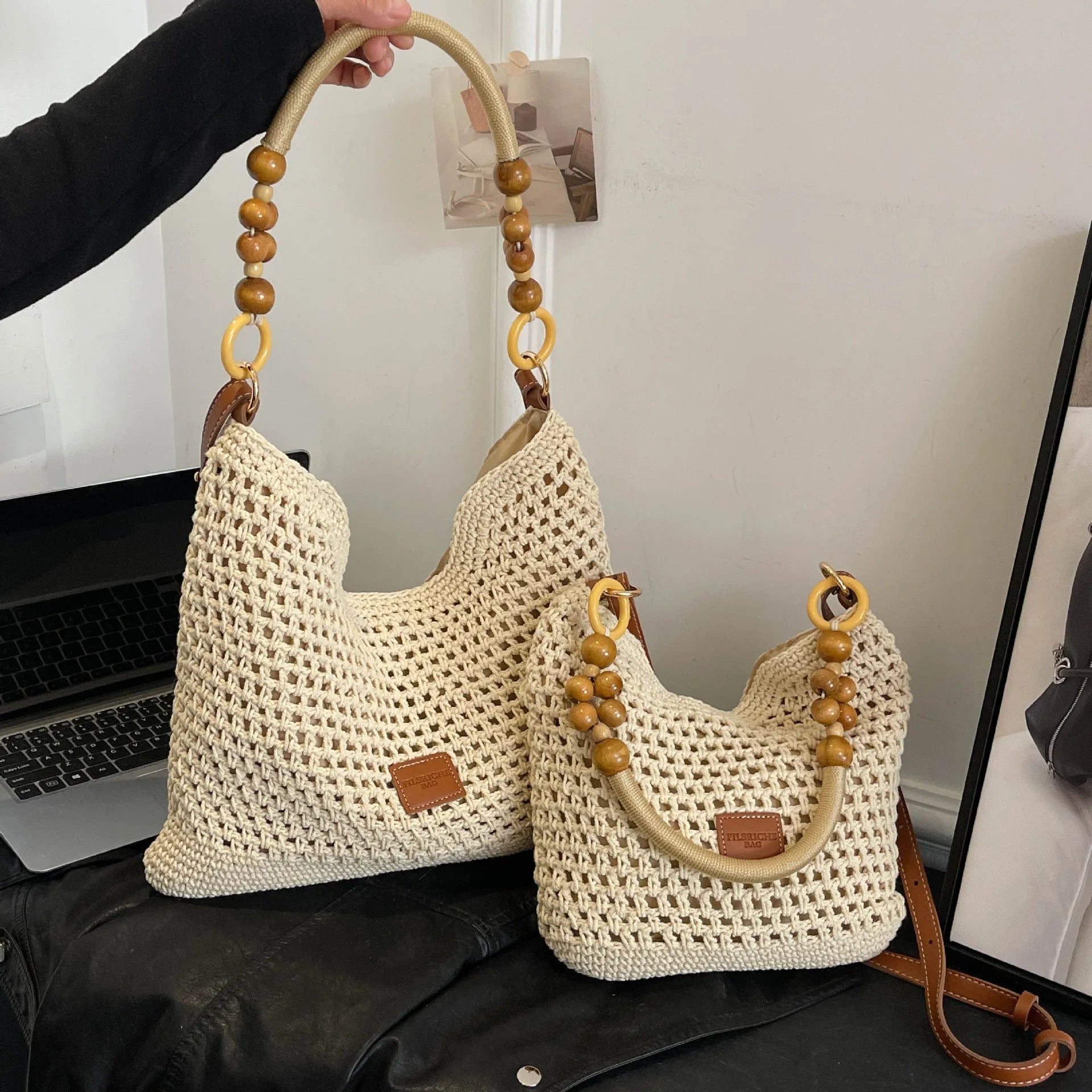 Large capacity knitted tote beach bag in brown with contrast stitching, bucket shape, crossbody strap, and zipped internal compartment