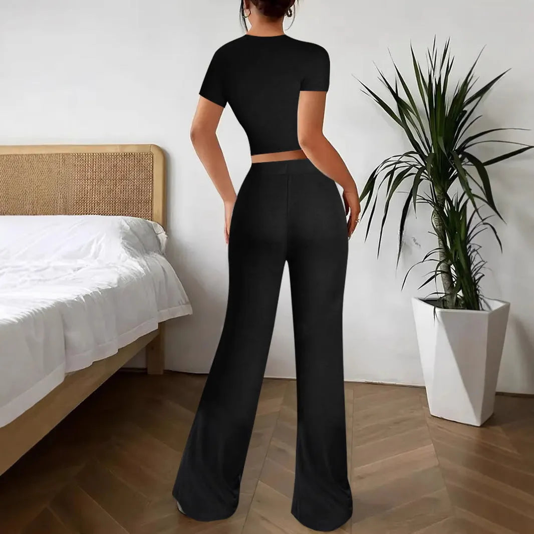 Women's black high-waist trouser and short-sleeve t-shirt suit set on hanger