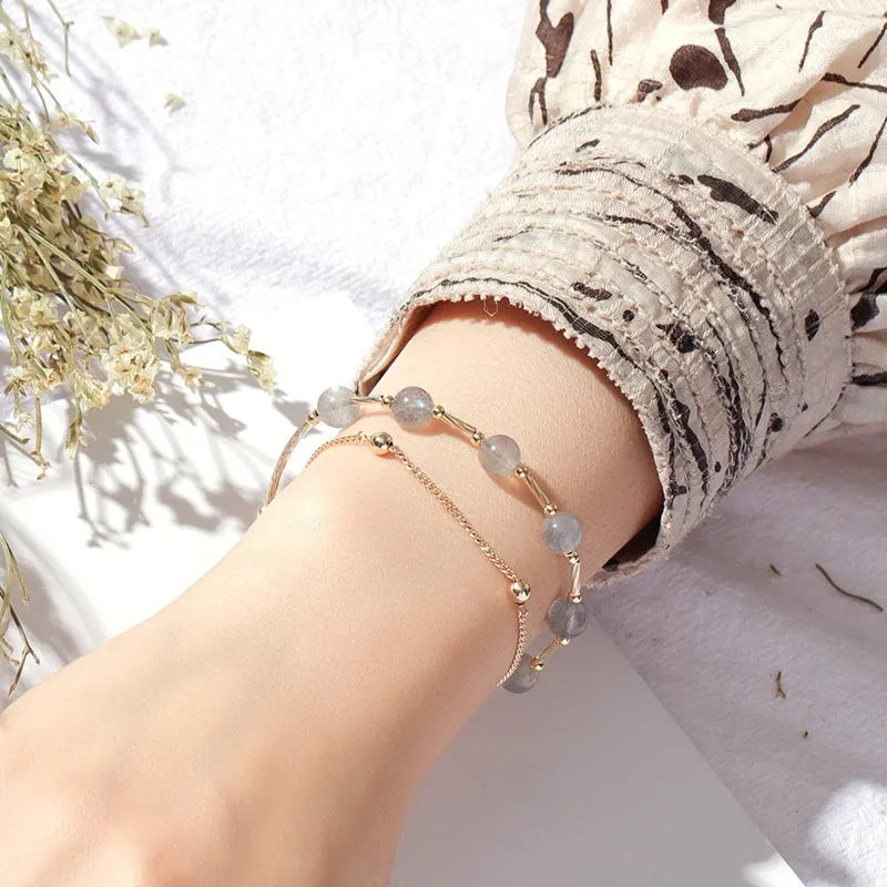 Crystal bracelet with double-layer copper tube and moonstone finish on white background