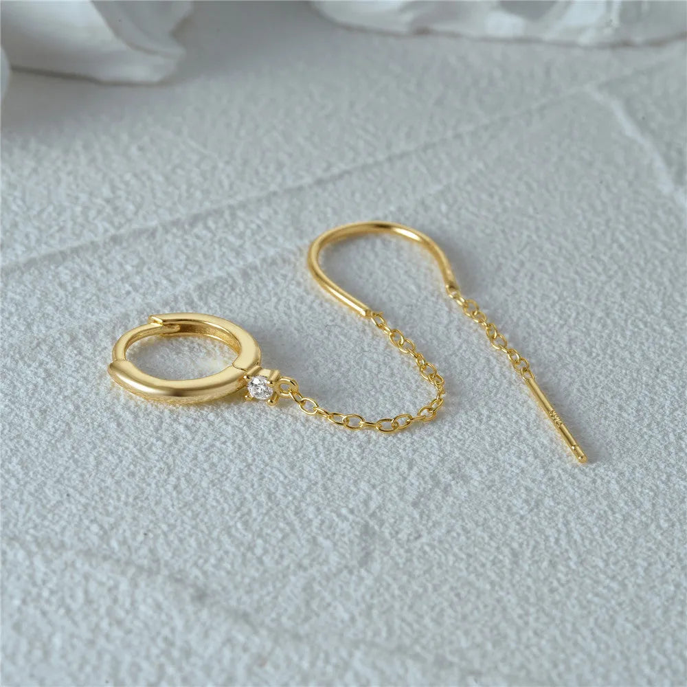 S925 sterling silver ear clip stud earrings with flower, tassel, and chain design in a gold colour.