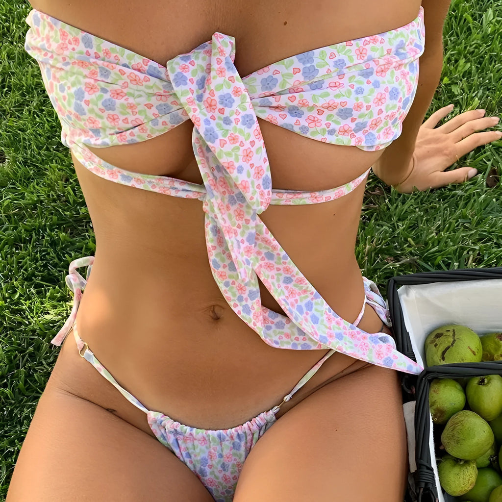 Women's lace-up front swimsuit with padded wireless support in a floral print.