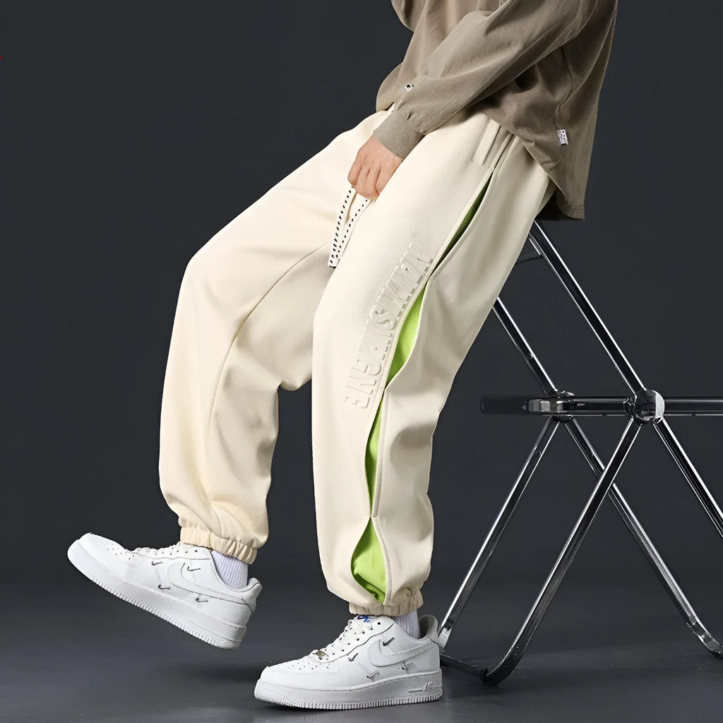 Men's cotton ankle banded pants with collage stitching printing in loose fit design
