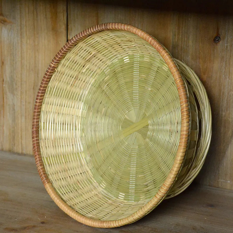 Handmade natural bamboo storage basket shown in one of three available sizes.