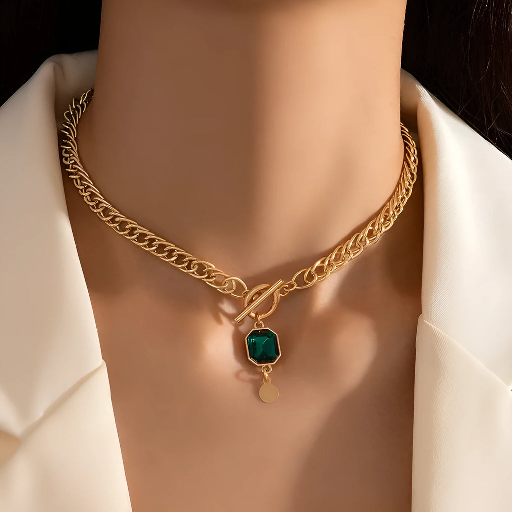 Gold-coloured geometric round zircon pendant necklace with a titanium steel Cuban link chain.