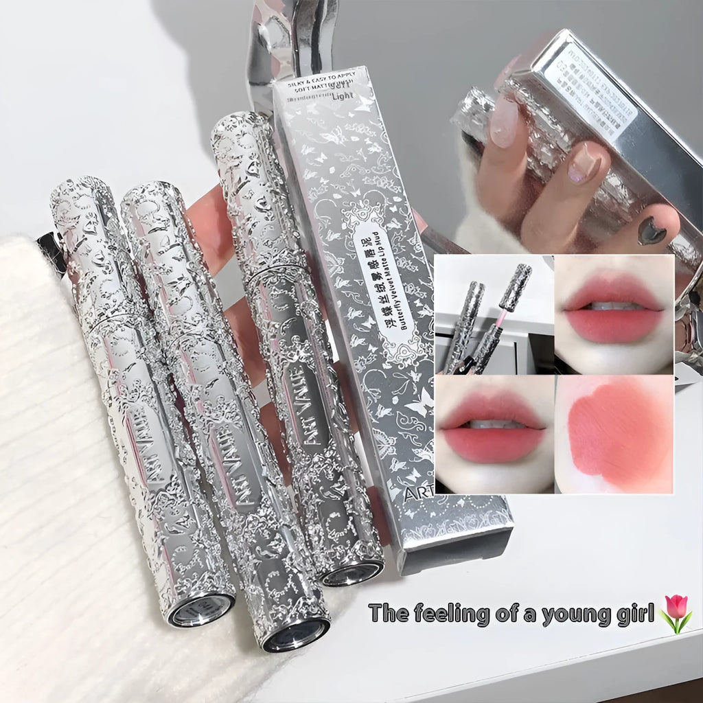 Velvet Mist Lip Mud matte white tube with six shade swatches: rose sweet mist, rock candy persimmon, oats cow's milk, sweet stained strawberries, spring cherry blossoms, cinnamon tea brown