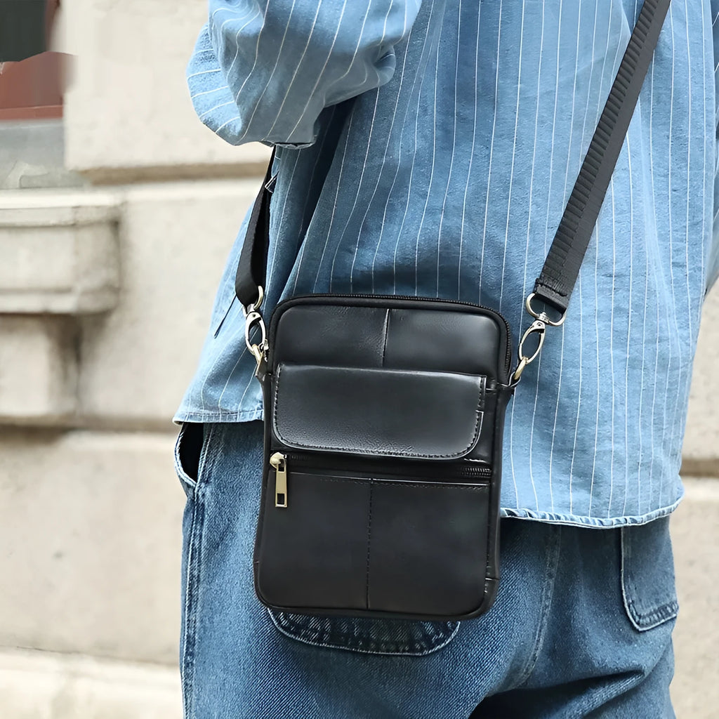 Men's brown genuine leather crossbody shoulder bag with sewing line details.