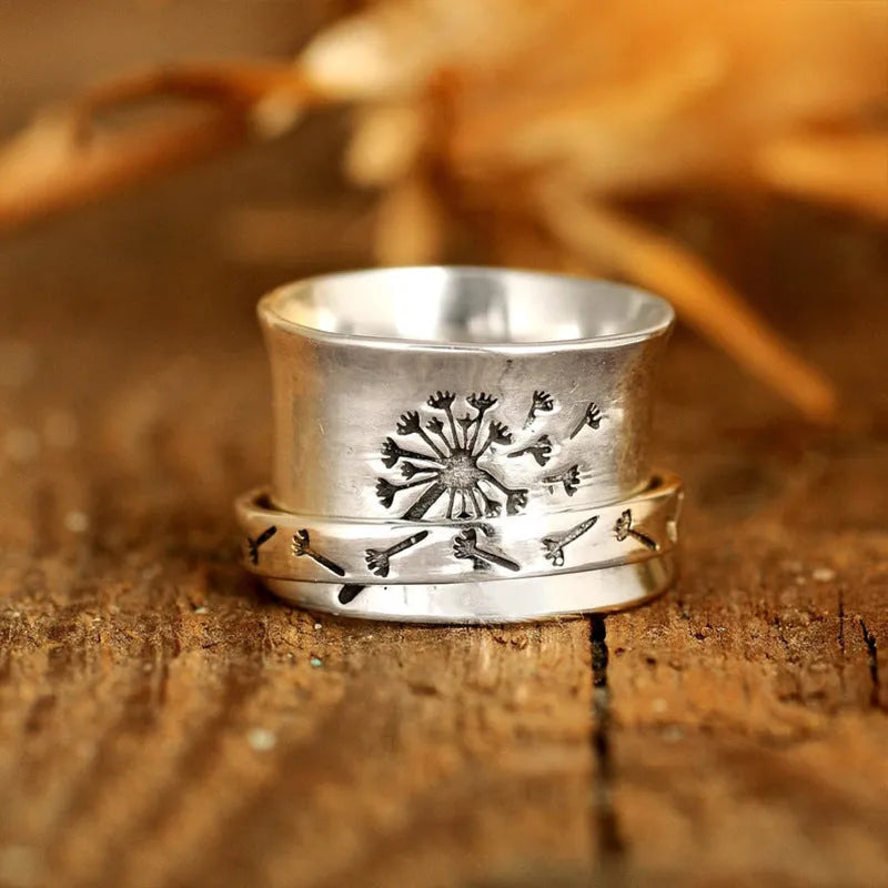 Silver electroplated alloy flower ring with rotatable design on finger