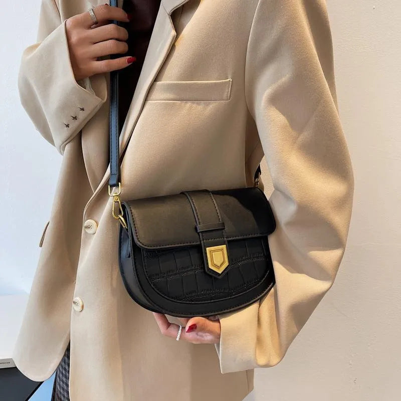 French one shoulder saddle bag in medium-soft PU with lock and stone pattern, available in black, brown, beige, and coffee