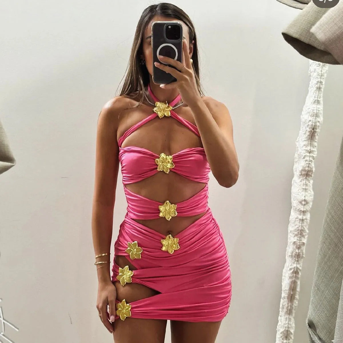 Women's solid colour one-piece swimsuit with hollow-out tube top and separate matching short skirt.