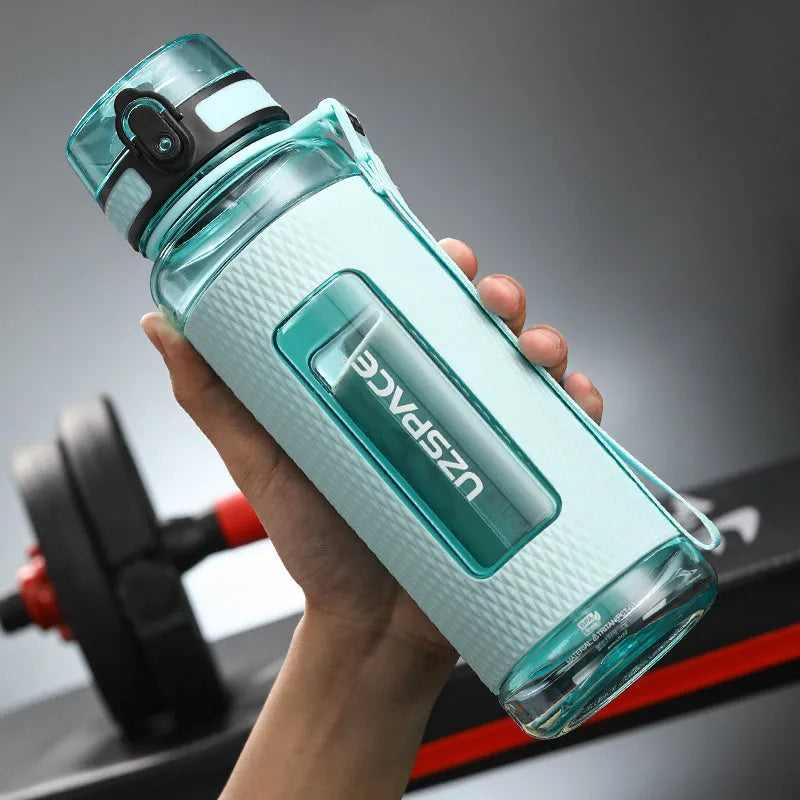 Portable sport water bottle in blue, copolymer polyester plastic, 1100ml capacity, with black cap.