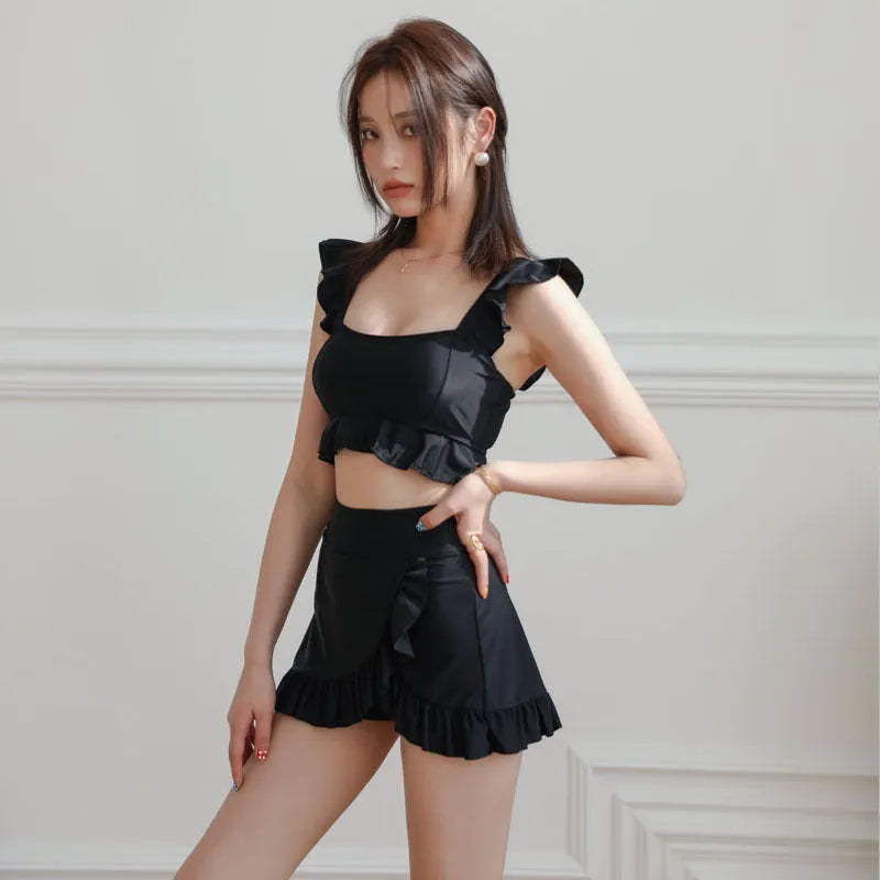 Women's black nylon split swimsuit brief style for swimming and wading flat lay
