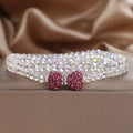 Double ring crystal bracelet with pearl and rhinestone accents on light background