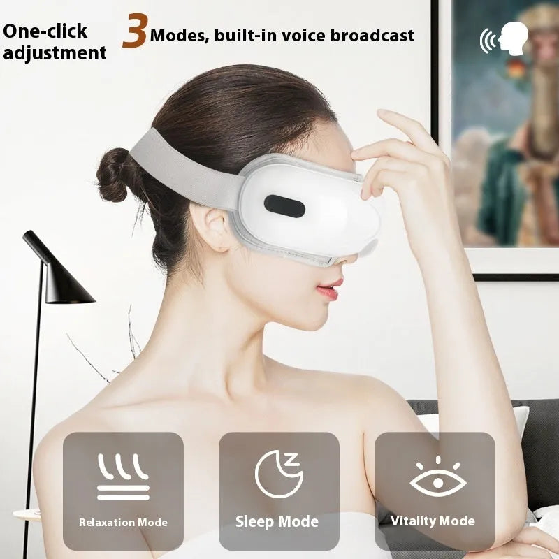 White rechargeable eye massager with hot compress function on a plain background